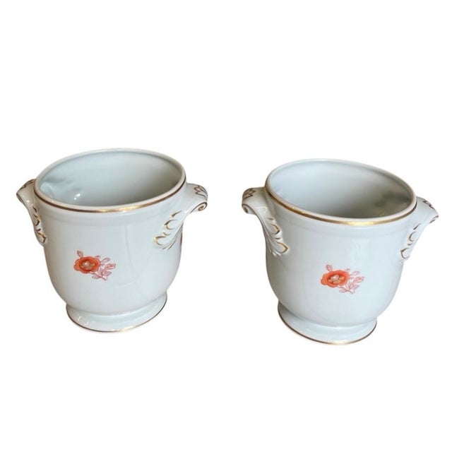 Elevate your tabletop or mantel with this exquisite pair of vintage porcelain cachepot vases. Crafted with a refined,...