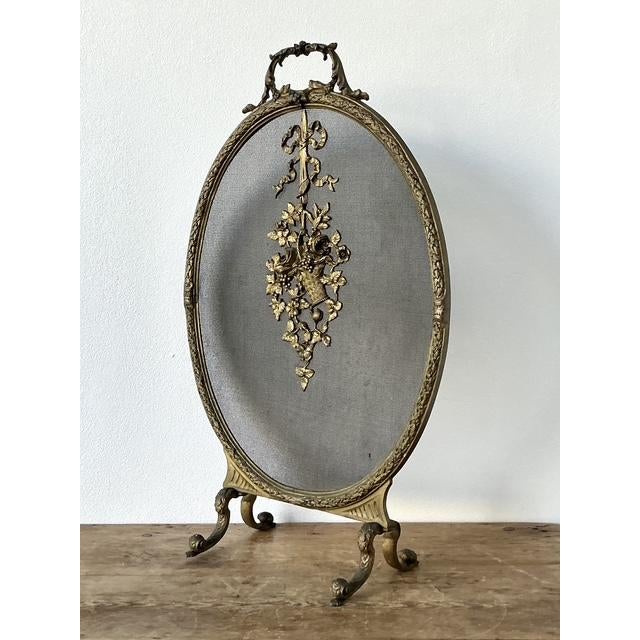 Elevate your hearth with the refined elegance of this vintage French Louis XVI style fireplace screen. This exquisite...