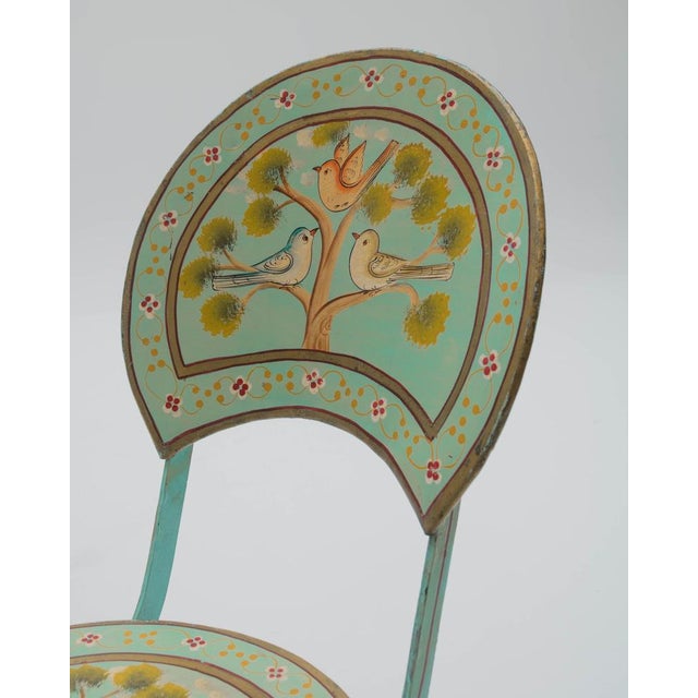Folk-art-style folding chairs, made in Spain around the 1940s, exemplify the functional decorative furniture of the...