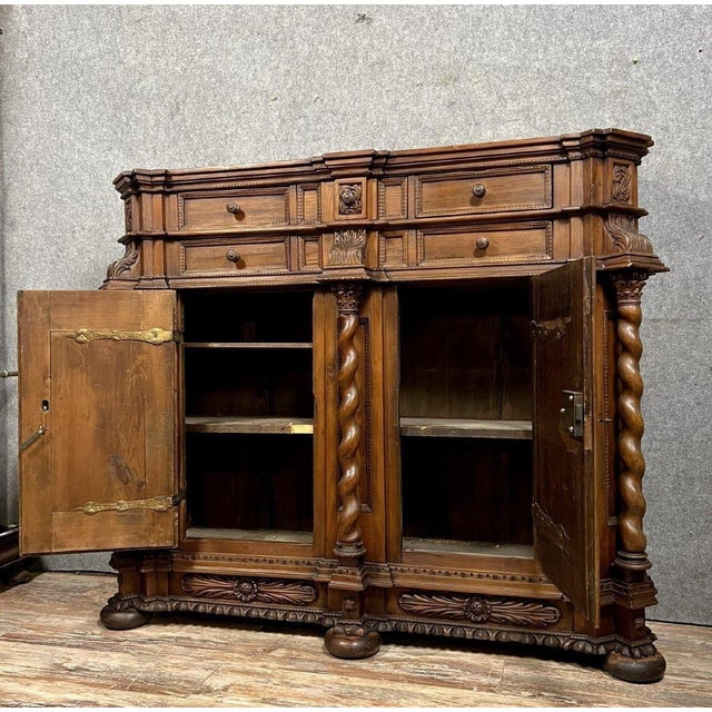 Alsatian sideboard in stained solid wood, circa 17th century, circa 1650 The projecting front opens with two large doors...