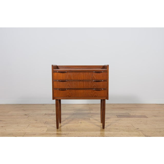 Mid century dresser designed by Henning Jørgensen. It has three drawers with uniquely profiled handles. Completely...