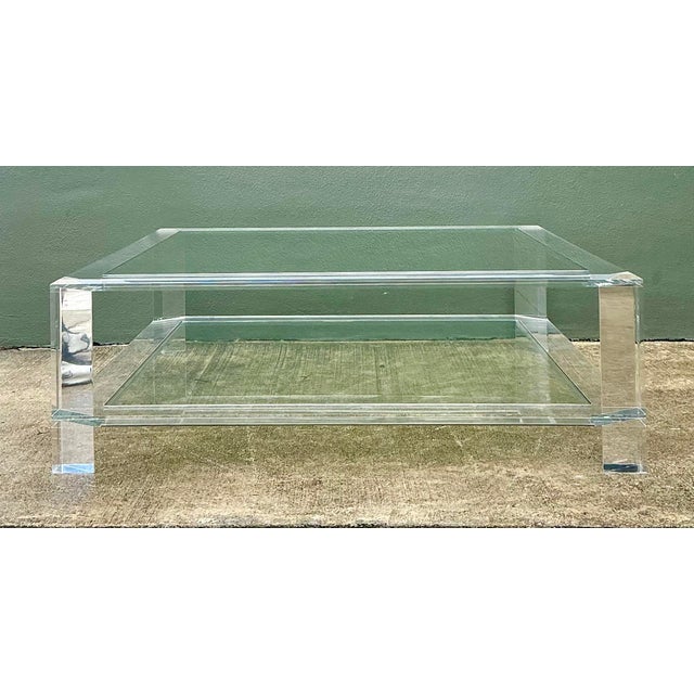 This monumental square coffee table from Interlude Home is a masterclass in transparent luxury. Featuring a heavy-gauge,...