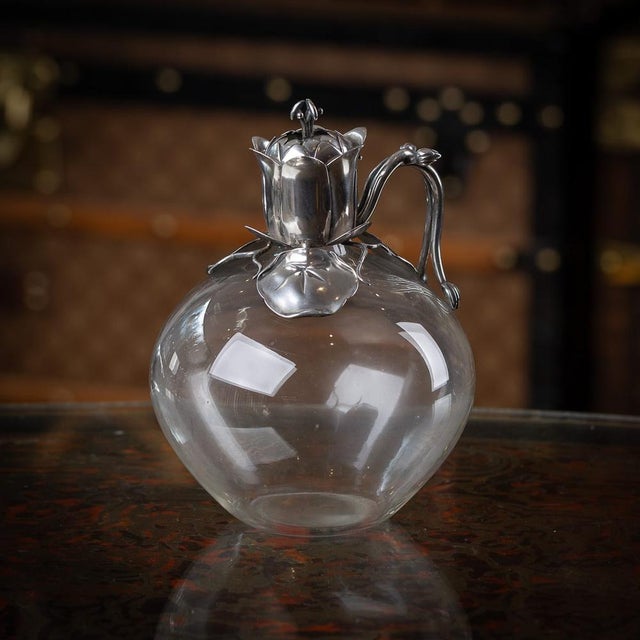 Antique 19th century victorian solid silver & clear glass claret jug. Modelled in a organic style with floral decorative...