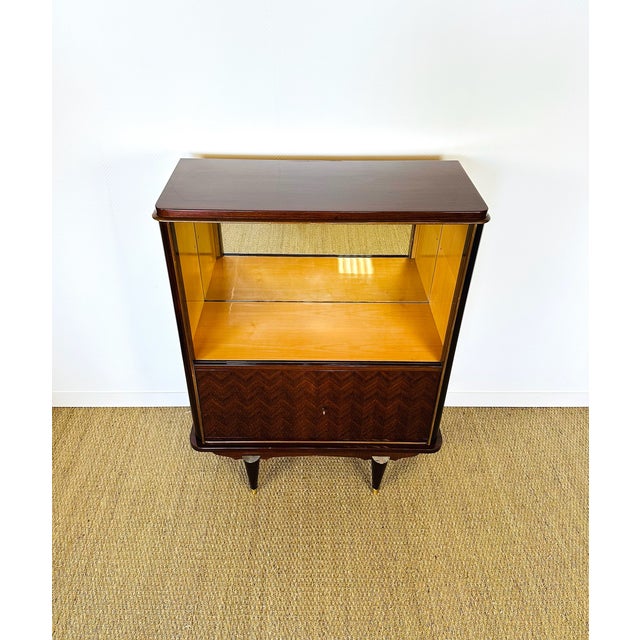Magnificent display cabinet dating from the 1950s, in a modernist or late Art Deco style, likely of French or Italian...