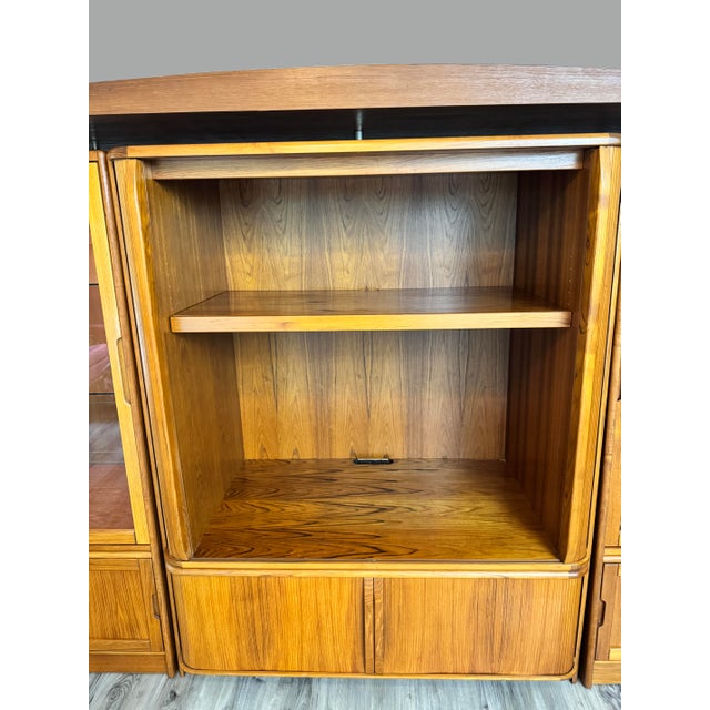 Stunning vintage mid-century modern teak entertainment center/hutch manufactured by Sun Cabinet. The cabinet has a warm...