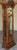 An elegant vintage Seth Thomas grandfather clock distinguished by its richly grained wood case, sculpted floral ornament,...