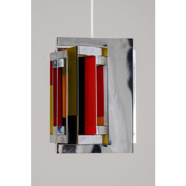 A striking and highly sculptural pendant from the 1960s, designed by simon henningsen. This rare chrome version of the...