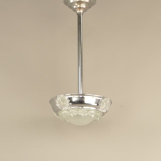 A French Art Deco ceiling light from circa 1935. The frame is made of nickel-plated copper. It features a signed "ZAN"...