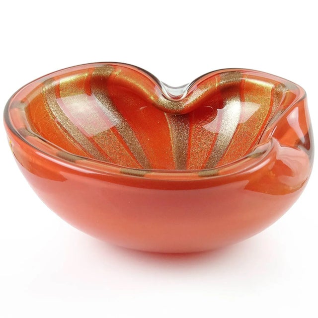 Gorgeous and large, vintage Murano hand blown persimmon orange, gold and aventurine flecks Italian art glass bowl. It is...