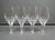 An elegant set of four vintage Josair “Napoleon” cut crystal wine glasses, distinguished by their sculptural cut-panel...