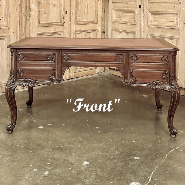 Antique French Louis XV Walnut Double-Faced Desk is a superlative example of fine French craftsmanship melded with what is...