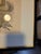 Painting labeled "The Jester" By Ben Shahn glass is broken on right corner.