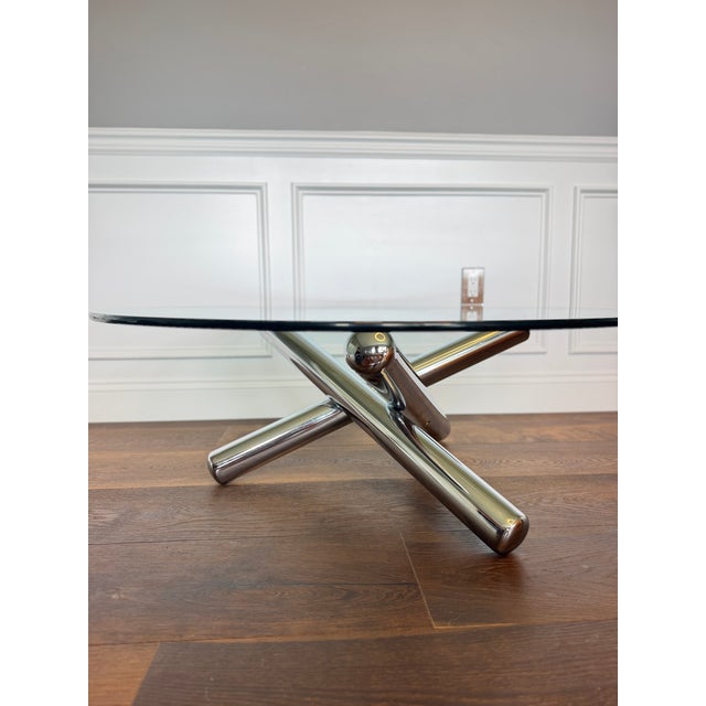 A striking example of late Modernist design, this iconic Jax coffee table by legendary American designer Milo Baughman...