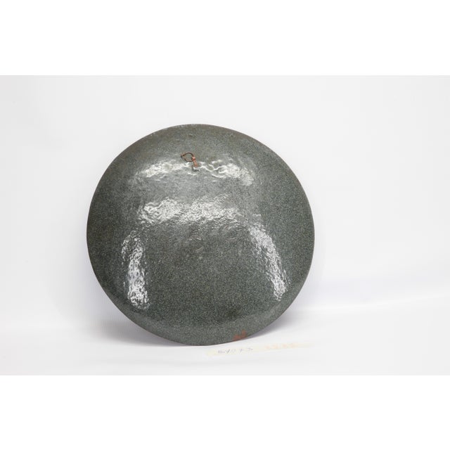 Decorative dish to be hanging made in Colisonné, enamelled copper metal, with a dancing clown on the center on the gold...