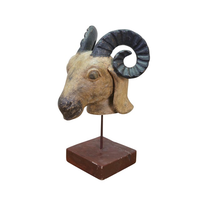 Vintage Indo Persian style hand-carved wooden ram or goat head bust sculpture with textured horns, mounted on an iron rod...