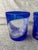 Vintage set of 2, mismatched, cut to clear, cobalt blue tumblers. One has a large leaf design, the other a branch with...
