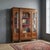 French-made bois de violette bookcase dating back to the late 19th century. Featuring glass fronts and sides, it features...