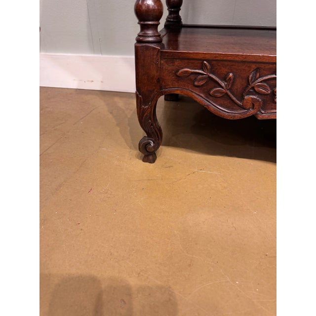 We love the charm of this French carved walnut console table to add character to any foyer. This table paired with a...