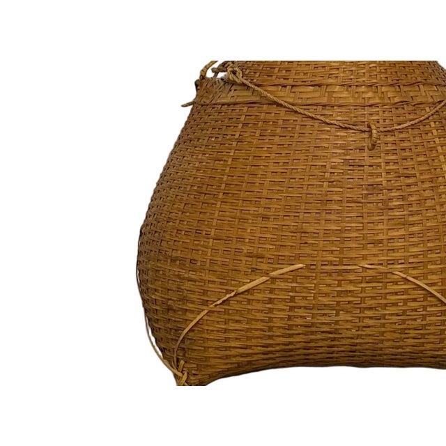 This vintage bamboo fishing basket is a beautiful example of traditional handwoven craftsmanship. Once used for carrying...