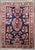 An authentic early 20th-century Sarouk carpet with a traditional formal design on a navy ground Measures: 1'10" x 2'6"...
