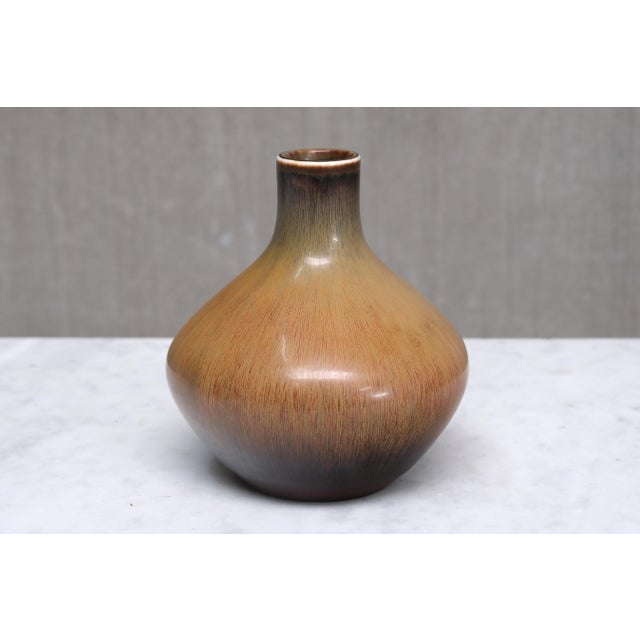 This rare stoneware vase was designed by Carl-Harry Stålhane and produced by Rörstrand in Sweden. The elegant, bulbous...