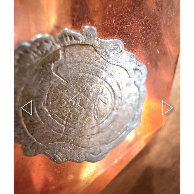 A striking vintage Italian glass bowl or ashtray with a warm salmon-pink to amber interior suspended within thick, clear...