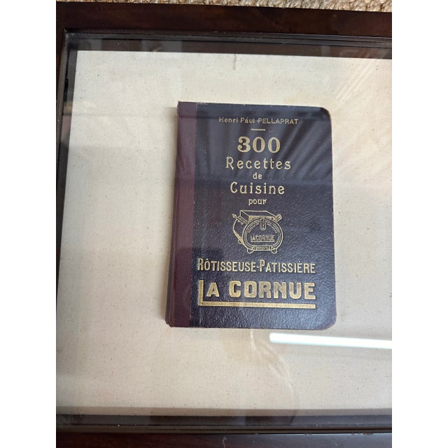 Framed First Edition of Le Cornue cook book in French.