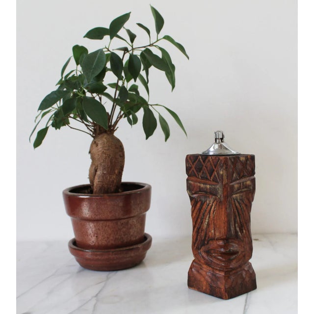 Vintage hand carved wood tiki table lighter. No makers mark. The light is untested. Some light age wear to wood.