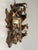 A beautifully detailed vintage hand-carved wood and gilt picture frame, featuring an elaborate openwork design of...