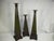 Set of 3 Arts and Crafts style pillar candleholders. Obelisk in shape, made of tin and painted with a deep green patina on...