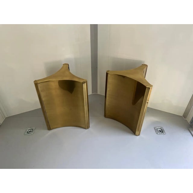 One of the hottest items currently with interior designers are these gleaming brass 'Trilobi' Mastercraft dining table...