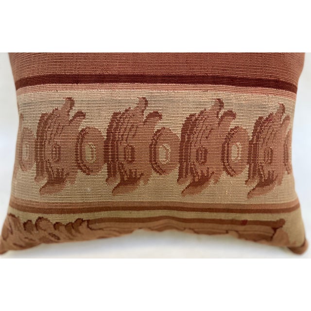 Decorative pillow upholstered in richly woven 19th century Aubusson tapestry, adorned with an elegant motif. A beautiful...