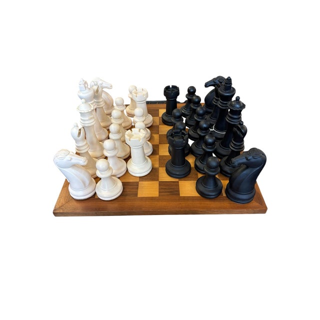 Classic tournament-inspired chess set featuring generously scaled Staunton-style pieces in contrasting ebony and ivory...