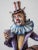 Hand-painted statue of a clown with barrels and a cup in his hand. The statue is signed on the back and marked on the...
