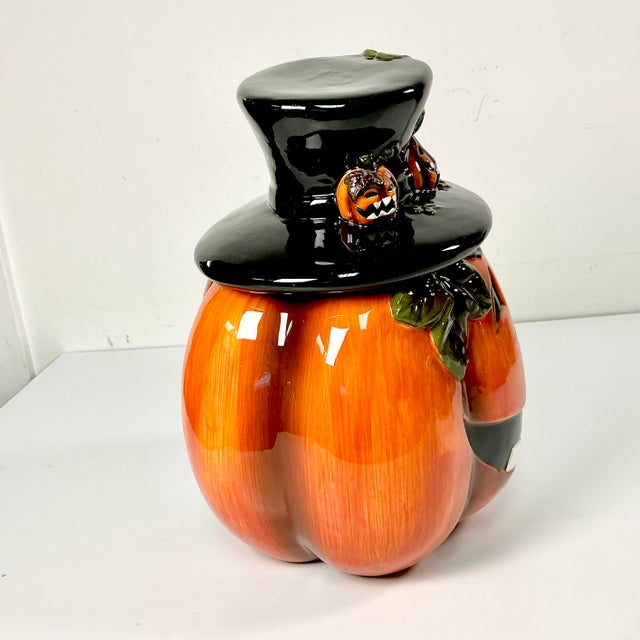 This boho chic style ceramic Jack-o-Lantern Cookie Jar adds a festive touch to your kitchen for Halloween. He is vibrant...