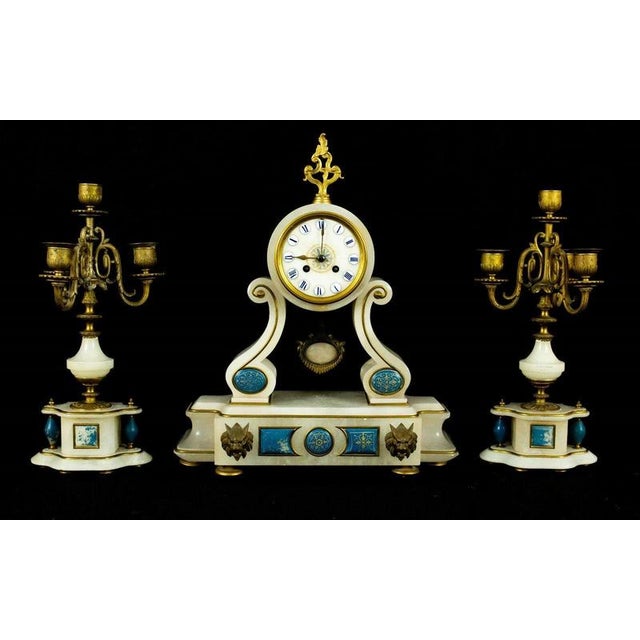 An impressive French three-piece clock garniture dating to circa 1870, comprising a substantial alabaster mantel clock...