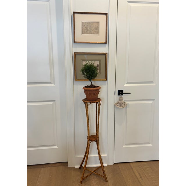 Vintage Palm Beach Style Rattan & Bamboo Two-Tiered Plant Stand CIRCA: Mid-20th Century MAKER'S MARK: None CONDITION: Good...