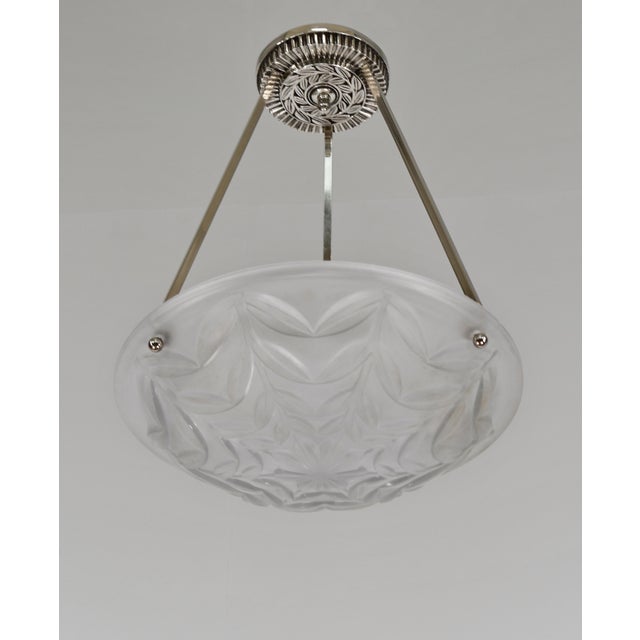 Degué A French art deco pendant chandelier made around 1930 in nickel plated bronze or solid brass holding a bowl by Degué...