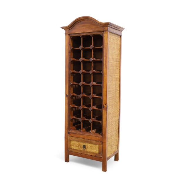 A rattan and wood wine rack; holds, 24 bottles of wine with storage drawer on bottom