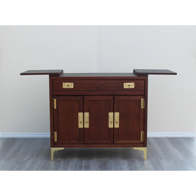 1970's campaign style bar cabinet This cabinet has been refinished in dark walnut with satin topcoat we updated with new...