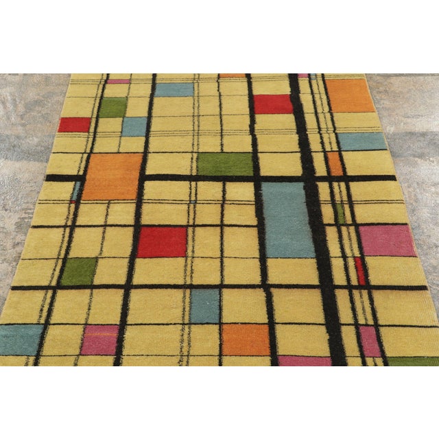 Hand-knotted in wool, circa 1950-1959, this 3x10 runner is a vibrant, architectural addition to Rug & Kilim’s Mid-Century...