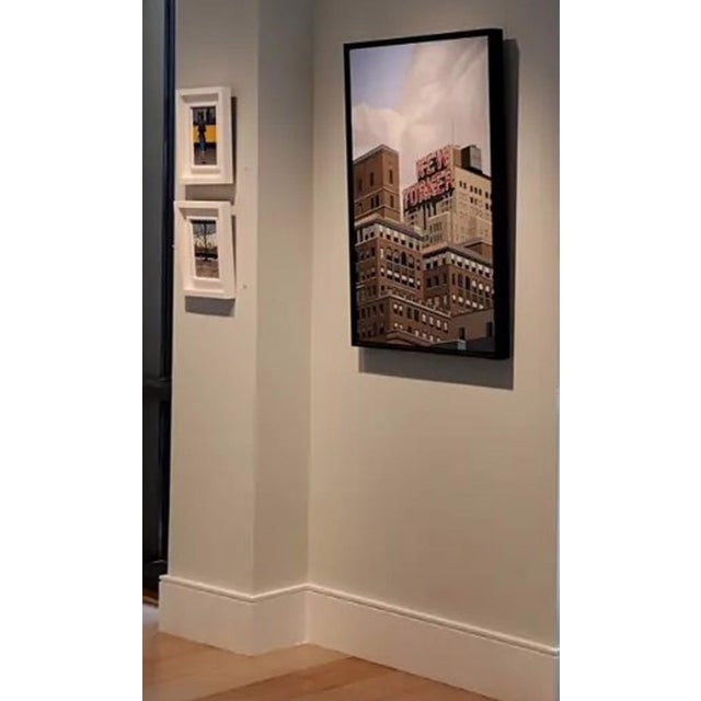This oil on canvas artwork depicts a striking urban scene featuring the iconic "New Yorker" sign atop a series of...