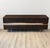 Seared oak sideboard featuring a broad horizontal inlay of high polished stainless steel bordered with live edge oak....