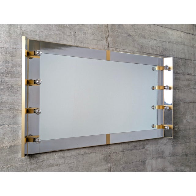 This dressing room mirror, designed by gaetano sciolari in italy during the 1970s, bears the manufacturer's signature. The...