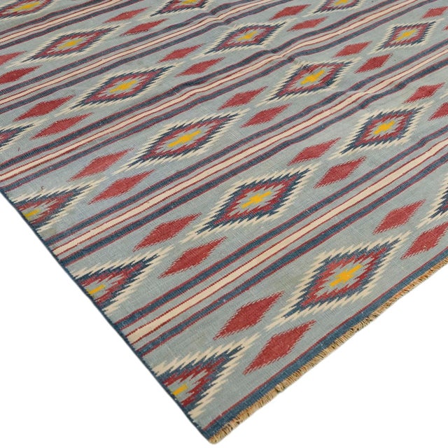 This 9x13 vintage Dhurrie rug is an exciting new curation from Rug & Kilim’s latest acquisition of rare and exemplary mid-...