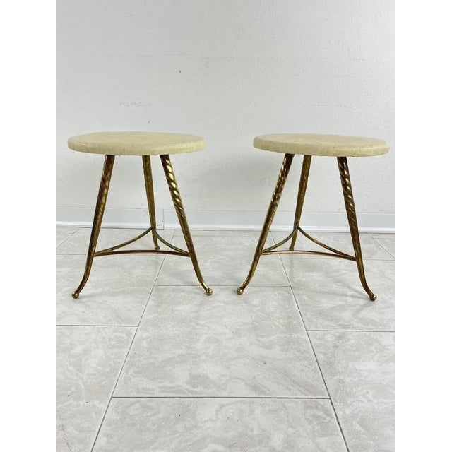 Set of 2 Mid-Century brass stools in the 1950s Paolo Buffa style. Intact and in good condition, small signs of aging. This...