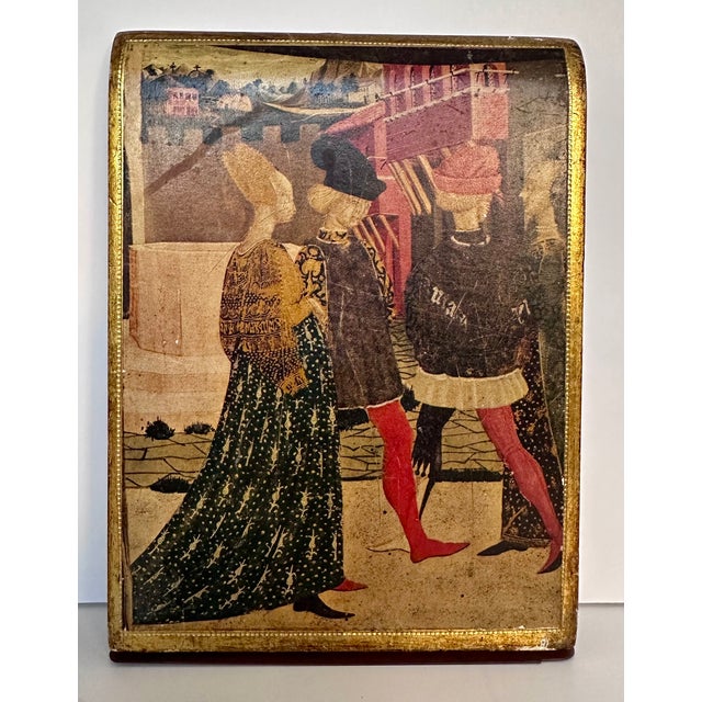 A pair of Florentine wood bookends depicting a 15th century Renaissance ceremony. From Fratelli Alinari in Florence....