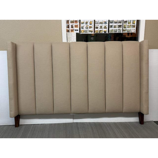 Design Plus Gallery presents a King Size Crawford Headboard from Brownstone Furniture. The headboard has a channel tufted...