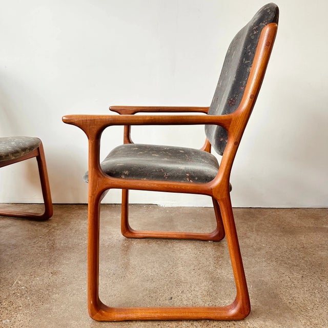 Mid-century Danish teak dining chairs with upholstery designed by R Huber and manufactured for John Krautwurst circa...