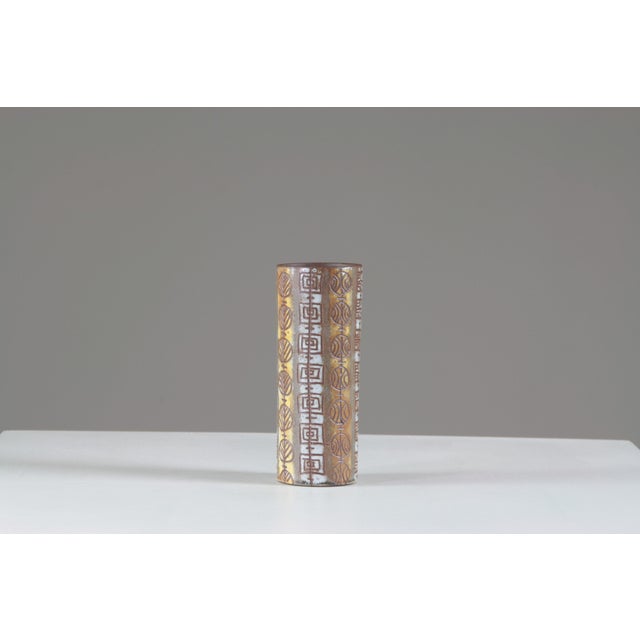 This ceramic roller vase, signed Alexandre Kostanda, was produced in the renowned workshops of Vallauris, an iconic center...